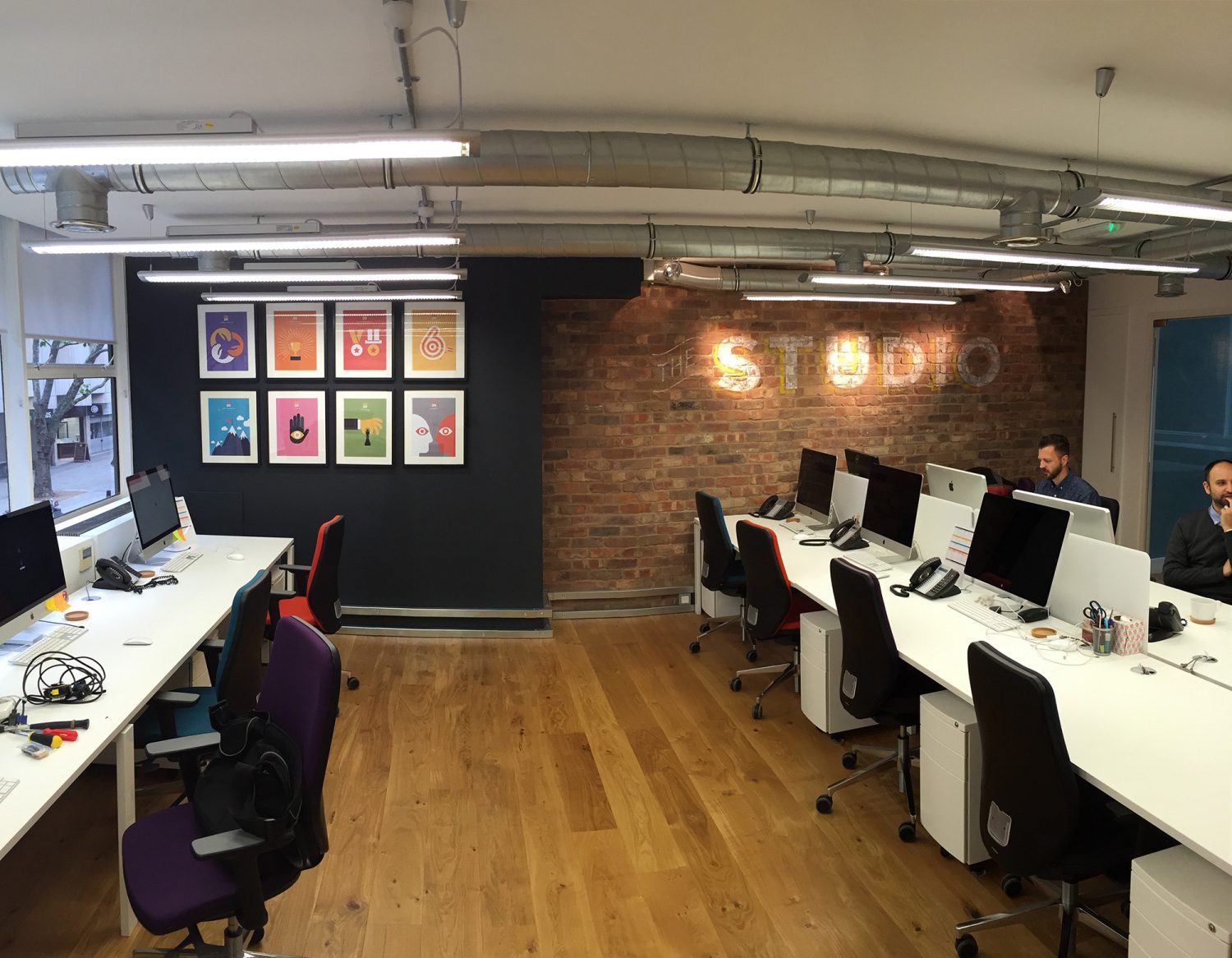 open plan office space with colourful images